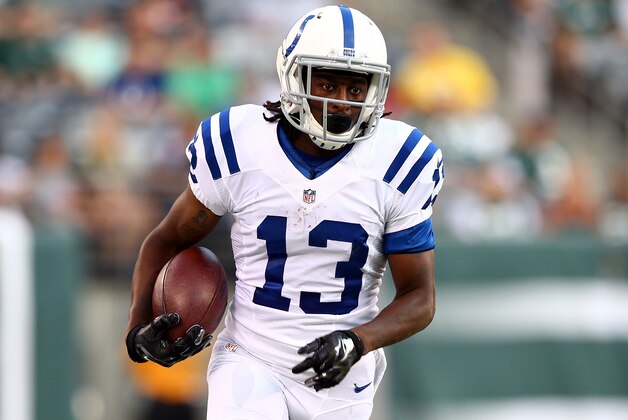 EAST RUTHERFORD, NJ - AUGUST 07: Wide receiver T.Y. Hilton #13 of the Indianapolis Colts runs with the ball against the New York Jets during a preseason game at MetLife Stadium on August 7, 2014 in East Rutherford, New Jersey.  (Photo by Elsa/Getty Images)