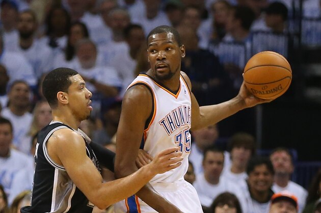 OKLAHOMA CITY, OK - MAY 31:  Kevin Durant #35 of the Oklahoma City Thunder looks to pass the ball against Danny Green #4 of the San Antonio Spurs in the first half during Game Six of the Western Conference Finals of the 2014 NBA Playoffs at Chesapeake Energy Arena on May 31, 2014 in Oklahoma City, Oklahoma. NOTE TO USER: User expressly acknowledges and agrees that, by downloading and or using this photograph, User is consenting to the terms and conditions of the Getty Images License Agreement.  (Photo by Ronald Martinez/Getty Images)
