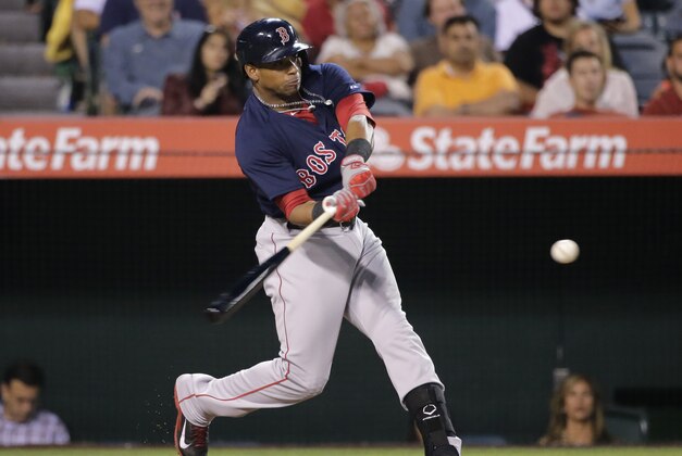 Boston Red Sox's Yoenis Cespedes hits a two-run double during the third inning of a baseball game against the Los Angeles Angels, Friday, Aug. 8, 2014, in Anaheim, Calif. (AP Photo/Jae C. Hong)