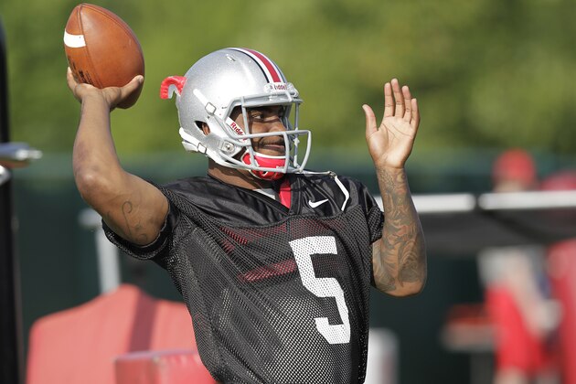 Ohio State quarterback Braxton Miller warms up during an NCAA college football practice Saturday, Aug. 9, 2014, in Columbus, Ohio. (AP Photo/Jay LaPrete)