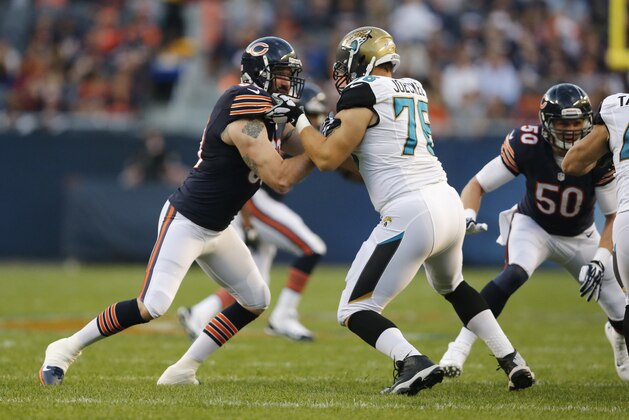 Chicago Bears defensive end Jared Allen (69) tries to move around Jacksonville Jaguars tackle Luke Joeckel (76) during the first half of an NFL preseason football game in Chicago, Thursday, Aug. 14, 2014. (AP Photo/Charles Rex Arbogast)