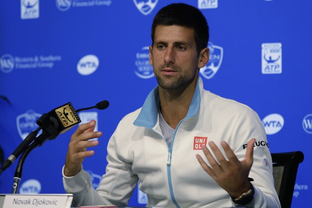 Novak Djokovic, from Serbia, answers questions during a news conference at the Western & Southern Open tennis tournament, Sunday, Aug. 10, 2014, in Mason, Ohio. Djokovic, the top seed, has been a finalist four times at the event, but has never won. (AP Photo/Al Behrman)