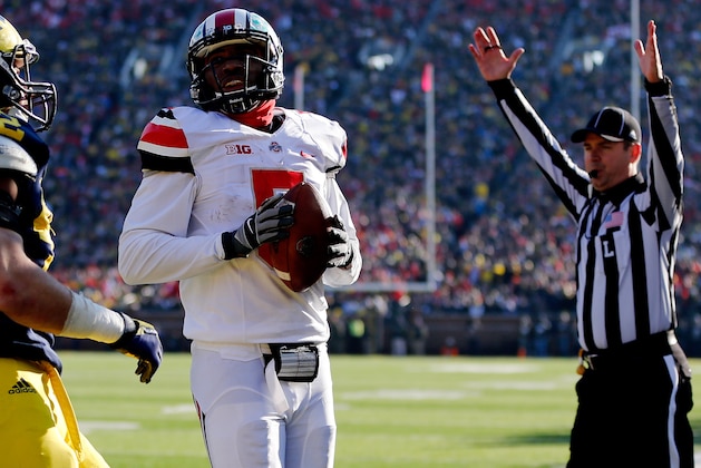 ANN ARBOR, MI - NOVEMBER 30:  Quarterback Braxton Miller #5 of the Ohio State Buckeyes scores a touchdown in the third quarter against the Michigan Wolverines during a game at Michigan Stadium on November 30, 2013 in Ann Arbor, Michigan.  (Photo by Gregory Shamus/Getty Images)
