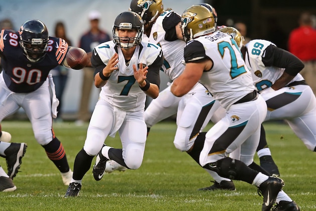 CHICAGO, IL - AUGUST 14: Chad Henne #7 of the Jacksonville Jaguars pitches the ball to Toby Gerhart #21 during the first quarter of a preseason game against the Chicago Bears at Soldier Field on August 14, 2014 in Chicago, Illinois.  (Photo by Jonathan Daniel/Getty Images)