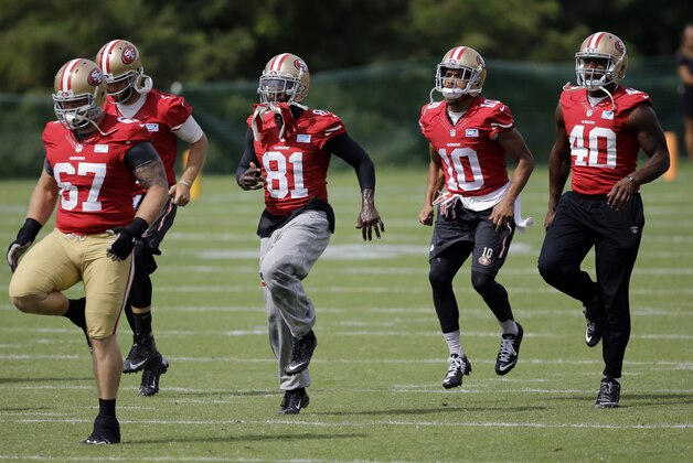 San Francisco 49ers wide receiver Anquan Boldin (81) warms up with guard Daniel Kilgore, from left, quarterback McLeod Bethel-Thompson, wide receiver David Reed and tight end Kevin Greene during an NFL football training camp practice, Monday, Aug. 11, 2014, in Owings Mills, Md. (AP Photo/Patrick Semansky)