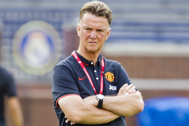 Manchester United manager Louis van Gaal watches his team during a training session, Friday, Aug. 1, 2014, at Michigan Stadium in Ann Arbor, Mich. Real Madrid will face Manchester United in a Guinness International Champions Cup match Saturday at this college football stadium. (AP Photo/Tony Ding)