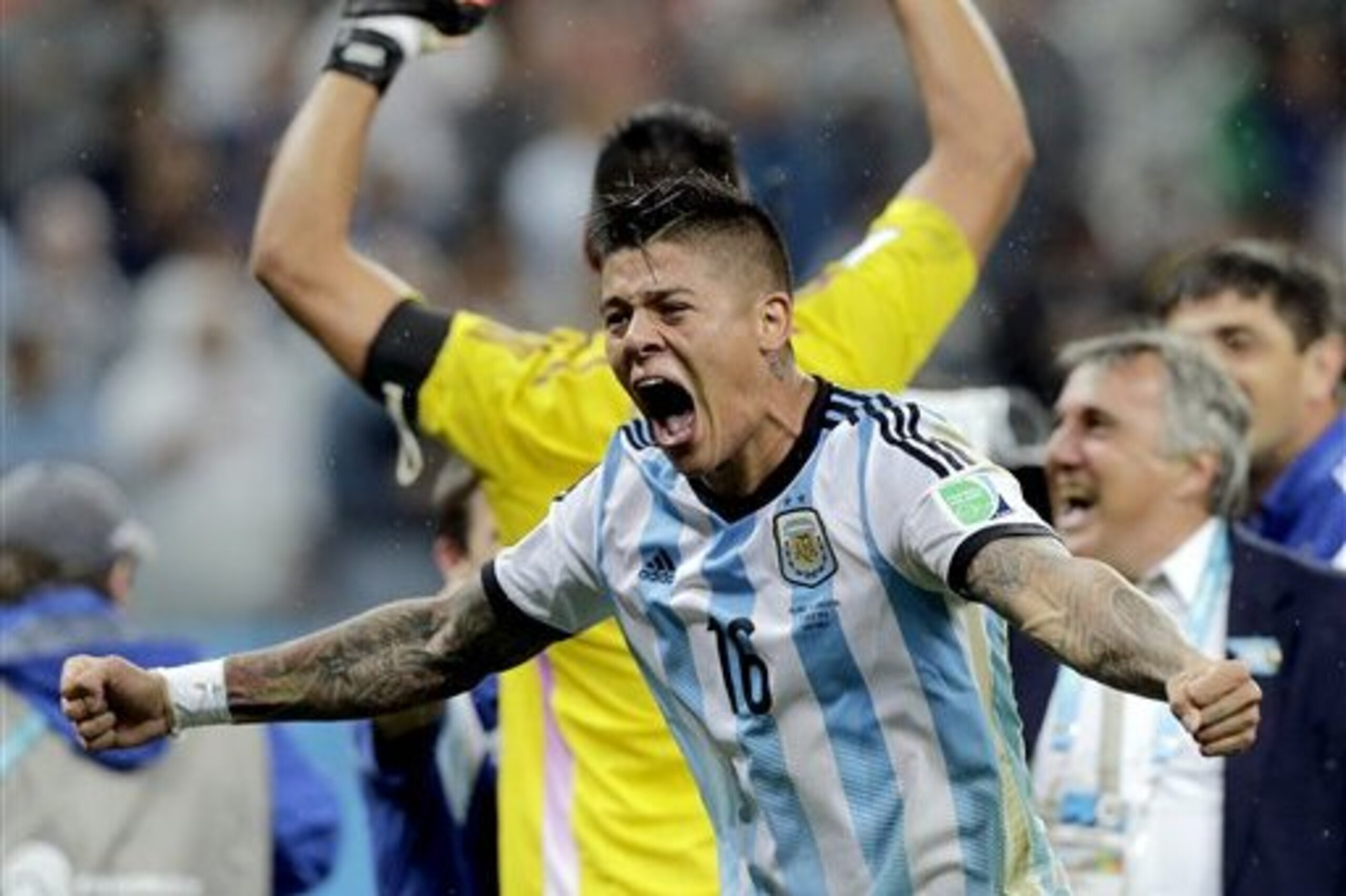 Argentina's Marcos Rojo celebrates after Argentina defeated the Netherlands 4-2 in a penalty shootout after a 0-0 tie after extra time to advance to the finals during the World Cup semifinal soccer match between the Netherlands and Argentina at the Itaquerao Stadium in Sao Paulo Brazil, Wednesday, July 9, 2014. (AP Photo/Victor R. Caivano)