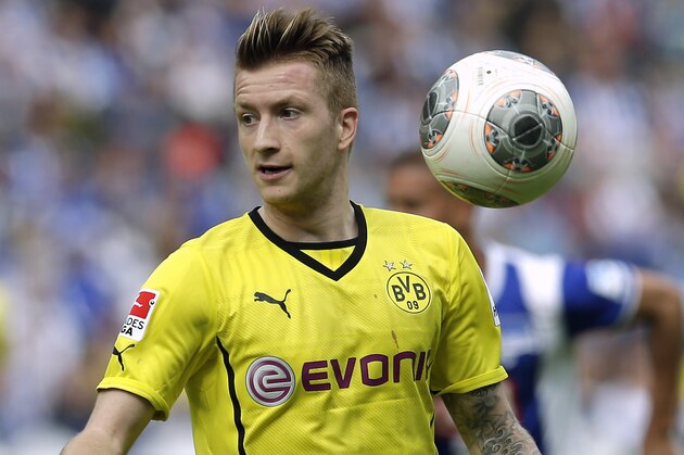 Dortmund's Marco Reus plays the ball during the German Bundesliga soccer match between Hertha BSC Berlin and Borussia Dortmund in Berlin, Germany, Saturday, May 10, 2014. Dortmund defeated Hertha by 4-0. (AP Photo/Michael Sohn)