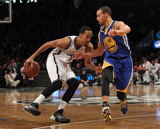 Jan 8, 2014; Brooklyn, NY, USA; Brooklyn Nets point guard Shaun Livingston (14) controls the ball in front of Golden State Warriors point guard Stephen Curry (30) during the fourth quarter of a game at Barclays Center. The Nets defeated the Warriors 102-98. Mandatory Credit: Brad Penner-USA TODAY Sports