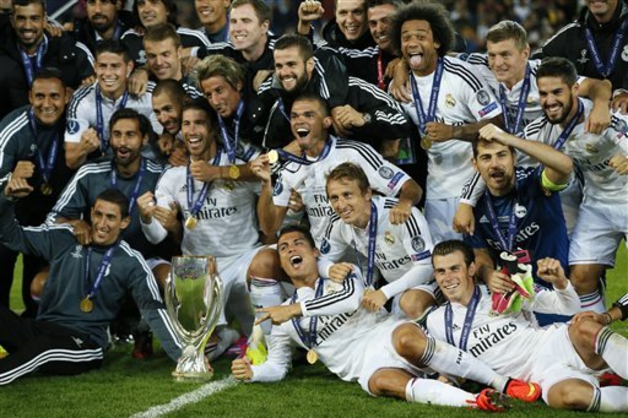 Real Madrid players pose with the trophy after winning the UEFA Super Cup soccer match between Real Madrid and Sevilla in Cardiff City Stadium, in Cardiff, Wales, Tuesday, Aug. 12, 2014. (AP Photo/Alastair Grant) Real Madrid players pose with the trophy after winning the UEFA Super Cup soccer match between Real Madrid and Sevilla in Cardiff City Stadium, in Cardiff, Wales, Tuesday, Aug. 12, 2014. (AP Photo/Alastair Grant)
