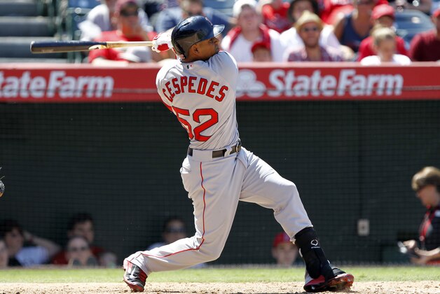 Boston Red Sox’ Yoenis Cespedes hits a three-run home run against the Los Angeles Angels in the seventh inning of a baseball game on Sunday, Aug. 10, 2014, in Anaheim, Calif. (AP Photo/Alex Gallardo)