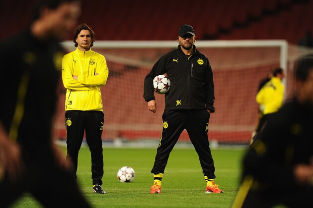 LONDON, ENGLAND - OCTOBER 21:  Borussia Dortmund coach Jurgen Klopp (R) and assistant Zeljko Buvac look on during a Borussia Dortmund training session ahead of the UEFA Champions League Group F match against Arsenal at Emirates Stadium on October 21, 2013 in London, England.  (Photo by Mike Hewitt/Getty Images)