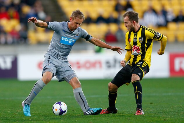 WELLINGTON, NEW ZEALAND - JULY 26:  Siem De Jong of Newcastle looks for a way around Jeremy Brockie of the Phoenix during the Football United New Zealand Tour match between the Wellington Phoenix and Newcastle United at Westpac Stadium on July 26, 2014 in Wellington, New Zealand.  (Photo by Phil Walter/Getty Images)