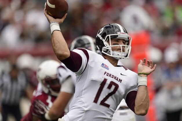 Sep 14, 2013; Philadelphia, PA, USA; Fordham Rams quarterback Michael Nebrich (12) passes the ball during the second quarter against the Temple Owls at Lincoln Financial Field. Fordham defeated Temple 30-29. Mandatory Credit: Howard Smith-USA TODAY Sports