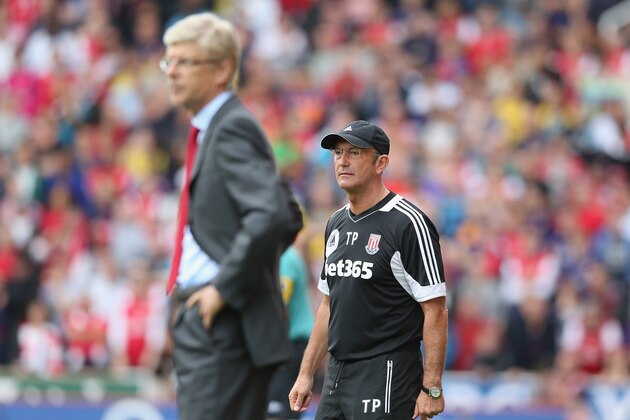 STOKE ON TRENT, ENGLAND - AUGUST 26: Tony Pulis (R) the Stoke City manager looks on with Arsene Wenger, the Arsenal manager during the Barclays Premier League match between Stoke City and Arsenal at the Britannia Stadium on August 26, 2012 in Stoke on Trent, England.  (Photo by David Rogers/Getty Images)