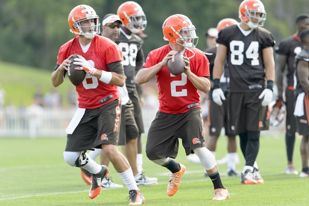 BEREA, OH - JULY 26: Quarterbacks Brian Hoyer #6 and quarterback Johnny Manziel #2 of the Cleveland Browns practice a play during training camp at the Cleveland Browns training facility on July 26, 2014 in Berea, Ohio. (Photo by Jason Miller/Getty Images)