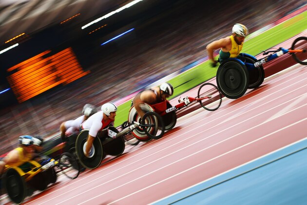 GLASGOW, SCOTLAND - JULY 31:   David Weir of England, Kurt Fearnley of Australia and Alex Dupont of Canada competes in the Men's T54 1500 metres final at Hampden Park during day eight of the Glasgow 2014 Commonwealth Games on July 31, 2014 in Glasgow, United Kingdom.  (Photo by Richard Heathcote/Getty Images)