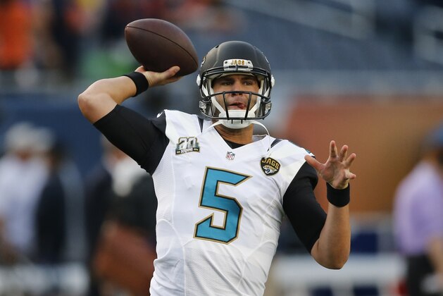 Jacksonville Jaguars quarterback Blake Bortles (5) passes during warmups  before an NFL preseason football game against the Jacksonville Jaguars in Chicago, Thursday, Aug. 14, 2014. (AP Photo/Charles Rex Arbogast)