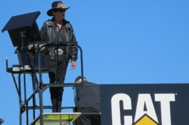 Richard Petty observes practice at Daytona International Speedway on top of a hauler.