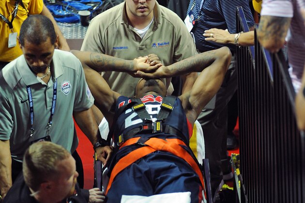 Aug 1, 2014; Las Vegas, NV, USA; Team USA basketball player Paul George is carted off the court on a gurney after suffering a broken leg during the USA Basketball Showcase at Thomas & Mack Center. Mandatory Credit: Stephen R. Sylvanie-USA TODAY Sports