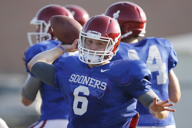 In this Tuesday, Aug. 5. 2014 photo, Oklahoma quarterback Baker Mayfield throws during a team practice in Norman, Okla. (AP Photo/Sue Ogrocki)