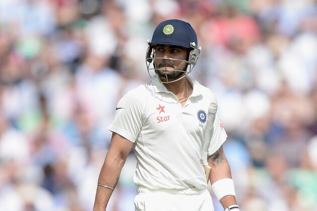 LONDON, ENGLAND - AUGUST 15:  Virat Kohli of India leaves the field after being dismissed by Chris Jordan of England during day one of 5th Investec Test match between England and India at The Kia Oval on August 15, 2014 in London, England.  (Photo by Gareth Copley/Getty Images)