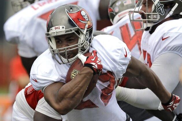 Tampa Bay Buccaneers running back Doug Martin (22) finds a hole during an NFL football training camp Sunday, Aug. 10, 2014, in Tampa, Fla. (AP Photo/Chris O'Meara)