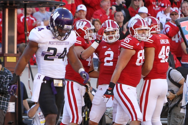 MADISON, WI - OCTOBER 12: Jacob Pendersen #46 of the Wisconsin Badgers celebrates with Joel Stave #2 after scoring a touchdown during the game against the Northwestern Wildcats at Camp Randall Stadium on October 12, 2013 in Madison, Wisconsin. (Photo by Mike McGinnis/Getty Images)
