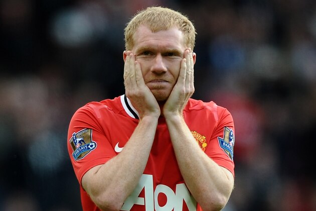 MANCHESTER, ENGLAND - MAY 06:  Paul Scholes of Manchester United looks dejected at the end of the Barclays Premier League match between Manchester United and Swansea City at Old Trafford on 6 May 2012 in Manchester, England.  (Photo by Laurence Griffiths/Getty Images)