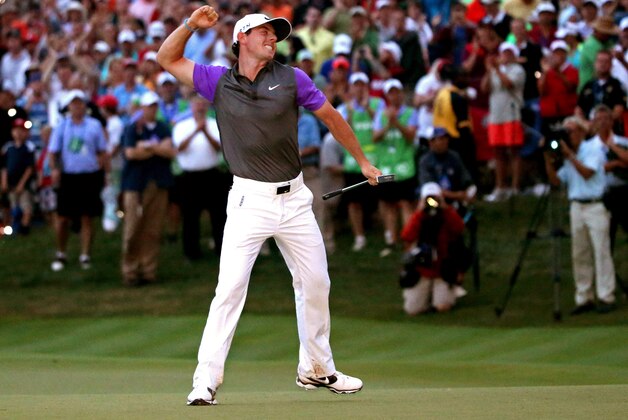 LOUISVILLE, KY - AUGUST 10:  Rory McIlroy of Northern Ireland celebrates his one-stroke victory on the 18th green during the final round of the 96th PGA Championship at Valhalla Golf Club on August 10, 2014 in Louisville, Kentucky.  (Photo by Andrew Redington/Getty Images)