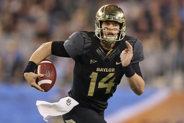 GLENDALE, AZ - JANUARY 01:  Quarterback Bryce Petty #14 of the Baylor Bears scrambles to pass during the Tostitos Fiesta Bowl against the UCF Knights at University of Phoenix Stadium on January 1, 2014 in Glendale, Arizona.  (Photo by Christian Petersen/Getty Images)