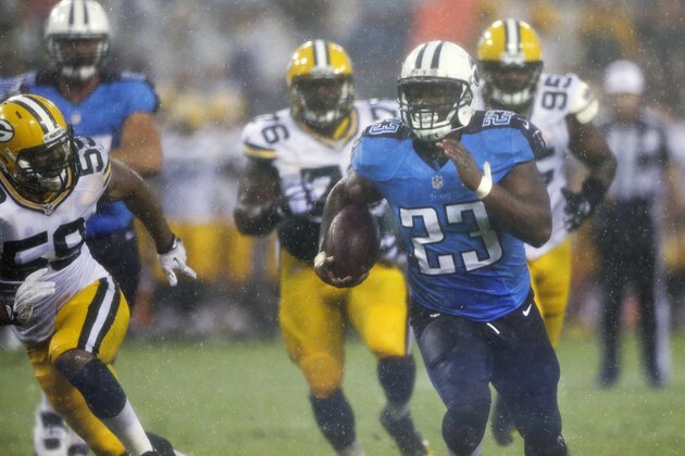 Tennessee Titans running back Shonn Greene (23) runs 13 yards for a touchdown as Green Bay Packers defenders Brad Jones (59), Mike Daniels (76) and Datone Jones (95) chase him in the first quarter of a preseason NFL football game Saturday, Aug. 9, 2014, in Nashville, Tenn. (AP Photo/Wade Payne)