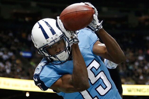 NEW ORLEANS, LA - AUGUST 15:  Justin Hunter #15 of the Tennessee Titans catches a pass for a touchdown during a preseason game against the New Orleans Saints at the Mercedes-Benz Superdome on August 15, 2014 in New Orleans, Louisiana.  (Photo by Stacy Revere/Getty Images)