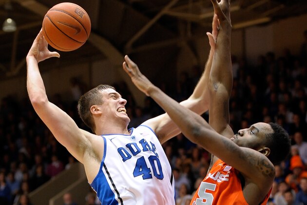 DURHAM, NC - FEBRUARY 22:  Marshall Plumlee #40 of the Duke Blue Devils drives to the basket against Rakeem Christmas #25 of the Syracuse Orange during their game at Cameron Indoor Stadium on February 22, 2014 in Durham, North Carolina.  (Photo by Grant Halverson/Getty Images)