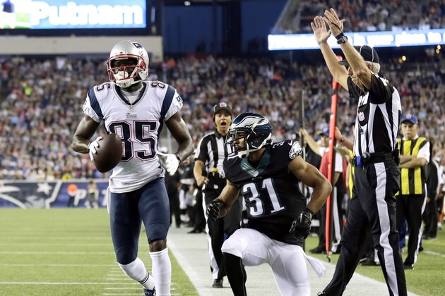 New England Patriots wide receiver Kenbrell Thompkins (85) scores a touchdown in front of Philadelphia Eagles defensive back Curtis Marsh (31) in the first quarter of an NFL football game Friday, Aug. 15, 2014, in Foxborough, Mass. (AP Photo/Charles Krupa)