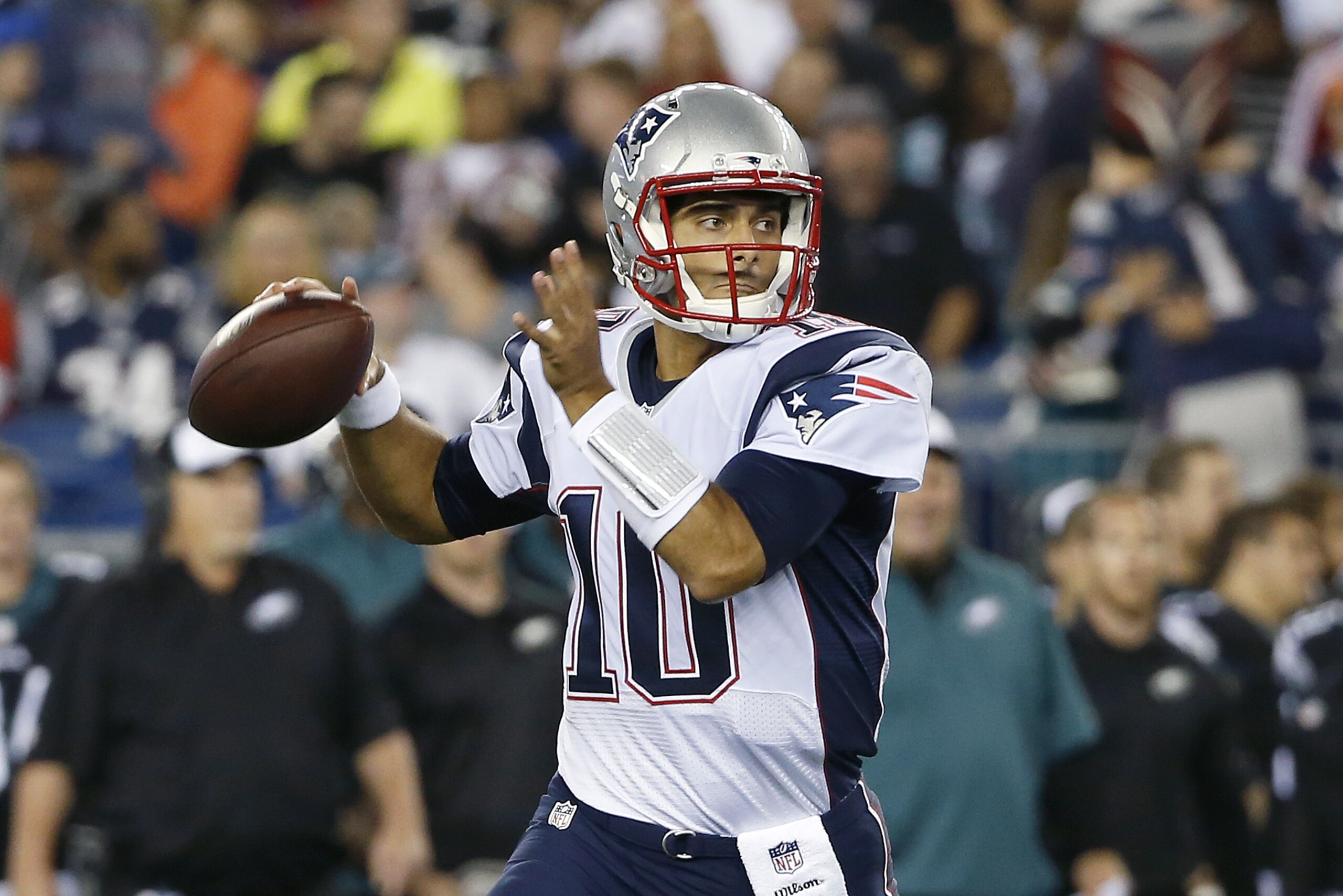 New England Patriots quarterback Jimmy Garoppolo looks for a pass receiver against the Philadelphia Eagles in the first half of an NFL preseason football game Friday, Aug. 15, 2014, in Foxborough, Mass. (AP Photo/Elise Amendola)