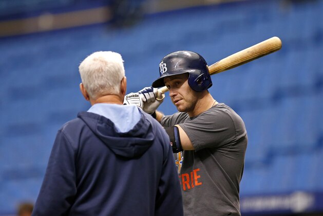 ST. PETERSBURG, FL - MAY 22:  Third baseman Evan Longoria (R) of the Tampa Bay Rays speaks with manager Joe Maddon of the Tampa Bay Rays during batting practice before the start of a game against the Oakland Athletics on May 22, 2014 at Tropicana Field in St. Petersburg, Florida.  (Photo by Brian Blanco/Getty Images)