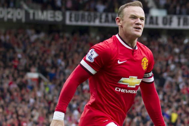Manchester United's Wayne Rooney celebrates after scoring against Swansea City during their English Premier League soccer match at Old Trafford Stadium, Manchester, England, Saturday Aug. 16, 2014. (AP Photo/Jon Super)