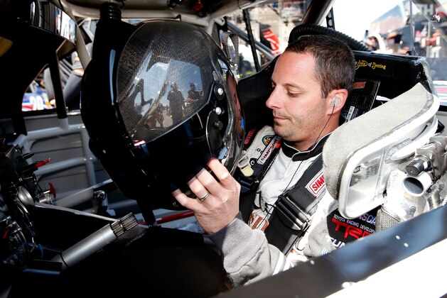 BROOKLYN, MI - AUGUST 15:  Johnny Sauter, driver of the #98 Nextant/Curb Toyota, sits in his truck during practice for the NASCAR Camping World Truck Series Careers for Veterans 200 at Michigan International Speedway on August 15, 2014 in Brooklyn, Michigan.  (Photo by Gregory Shamus/Getty Images)