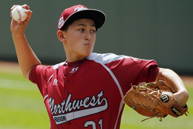 Lynnwood pitcher Tai Starchman delivers  against Rapid City during the first inning of  a baseball game at the Little League World Series tournament in South Williamsport, Pa., Saturday, Aug. 16, 2014. (AP Photo/Gene J. Puskar)
