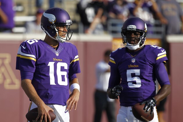Minnesota Vikings quarterback Matt Cassel (16) and Minnesota Vikings quarterback Teddy Bridgewater (5) wait to throw before a exhibition NFL football game at TCF Bank Stadium in Minneapolis, Friday, Aug. 8, 2014.  (AP Photo/Ann Heisenfelt)