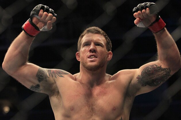 Ryan Bader celebrates after beating Jason Brilz by knockout in the first round of a UFC 139 Mixed Martial Arts light heavyweight bout in San Jose, Calif., Saturday, Nov. 19, 2011. (AP Photo/Jeff Chiu)