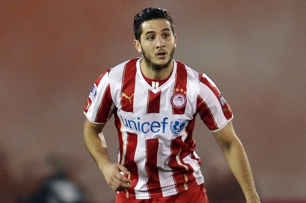 ATHENS,GREECE - JANUARY 12:  Kostas Manolas of Olympiacos during the Greek Superleague match between Atromitos Athinon and Olympiacos at the Peristeri Stadium on January 12, 2014 in Athens,Greece.  (Photo by Aris Messins/EuroFootball/Getty Images)