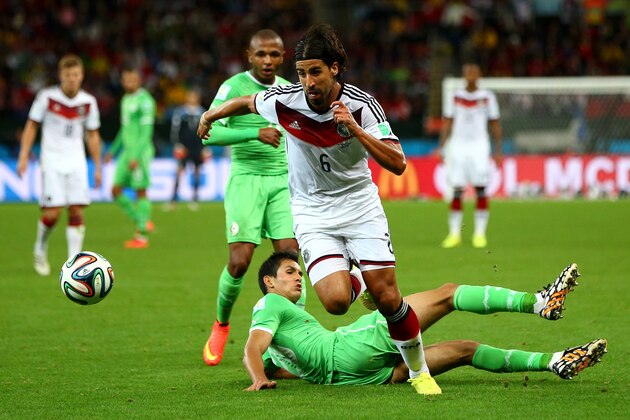 PORTO ALEGRE, BRAZIL - JUNE 30:  Sami Khedira of Germany controls the ball past Aissa Mandi of Algeria during the 2014 FIFA World Cup Brazil Round of 16 match between Germany and Algeria at Estadio Beira-Rio on June 30, 2014 in Porto Alegre, Brazil.  (Photo by Jamie Squire/Getty Images)