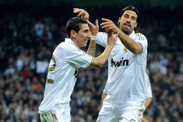 MADRID, SPAIN - NOVEMBER 26:  Angel di Maria (L) of Real Madrid celebrates with Sami Khedira after scoring his team's second goal during the La Liga match between Real Madrid and Atletico Madrid at Estadio Santiago Bernabeu on November 26, 2011 in Madrid, Spain.  (Photo by Denis Doyle/Getty Images)