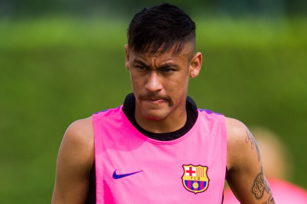 BARCELONA, SPAIN - AUGUST 17:  Neymar looks on during a FC Barcelona training session at Ciutat Esportiva on August 17, 2014 in Barcelona, Spain.  (Photo by Alex Caparros/Getty Images)