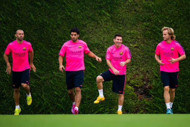 BARCELONA, SPAIN - AUGUST 17: Javier Mascherano, Luis Suarez, Lionel Messi and Ivan Rakitic (L-R) in action during a FC Barcelona training session at Ciutat Esportiva on August 17, 2014 in Barcelona, Spain.  (Photo by Alex Caparros/Getty Images)