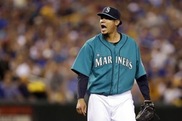 Seattle Mariners starting pitcher Felix Hernandez yells at the end of the seventh inning of a baseball game against theToronto Blue Jays, Monday, Aug. 11, 2014, in Seattle. (AP Photo/Ted S. Warren)