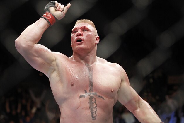 Brock Lesnar celebrates his UFC heavyweight mixed martial arts title match win against Shane Carwin Saturday, July 3, 2010, at The MGM Grand Garden Arena in Las Vegas. (AP Photo/Eric Jamison)
