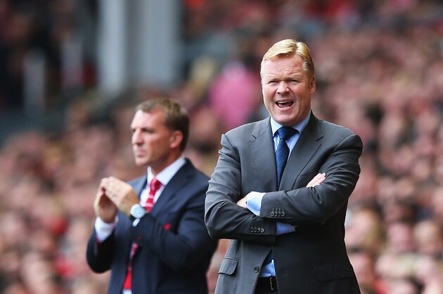 LIVERPOOL, ENGLAND - AUGUST 17: Ronald Koeman, manager of Southampton gives instructions with Brendan Rodgers, manager of Liverpool during the Barclays Premier League match between Liverpool and Southampton at Anfield on August 17, 2014 in Liverpool, England.  (Photo by Alex Livesey/Getty Images)
